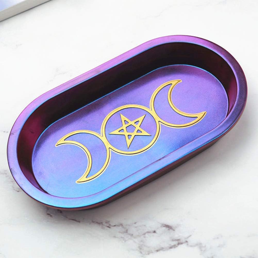 Purple and blue metallic tray with gold wiccan symbol on a resin surface