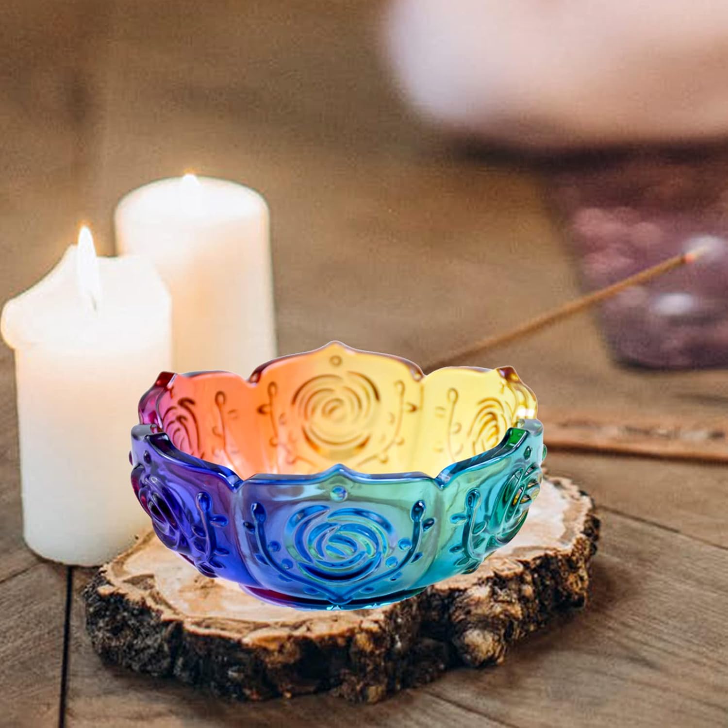 Colorful resin candle holder with candles and incense on resin surface