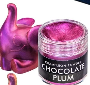 Jar of chameleon powder in chocolate plum color with a pink elephant figurine.